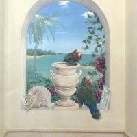 The birds are rare Bahama Parrots, the shell and tile products of local ceramic artisans. The urn matches the marble tiles of the room. The medium is acrylic on to emulsion on plaster. Completed September 2007