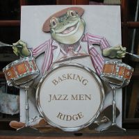 Frog Jazz Quartet cut-outs and background. In this commission the clients wanted something to fill an architectural oddity of their breakfast room, a shelf over the ceiling of an adjoining utility room. I came up with a minstrels gallery with a frog jazz quartet. The medium is acrylic on to emulsion on plaster. Plus MDF cut-outs. Completed June 2007.